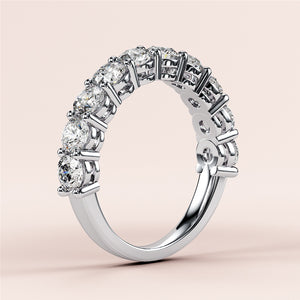 Elegant 14K or 18K gold or platinum three-quarter eternity wedding band with brilliant round-cut diamonds, showcasing timeless luxury. 