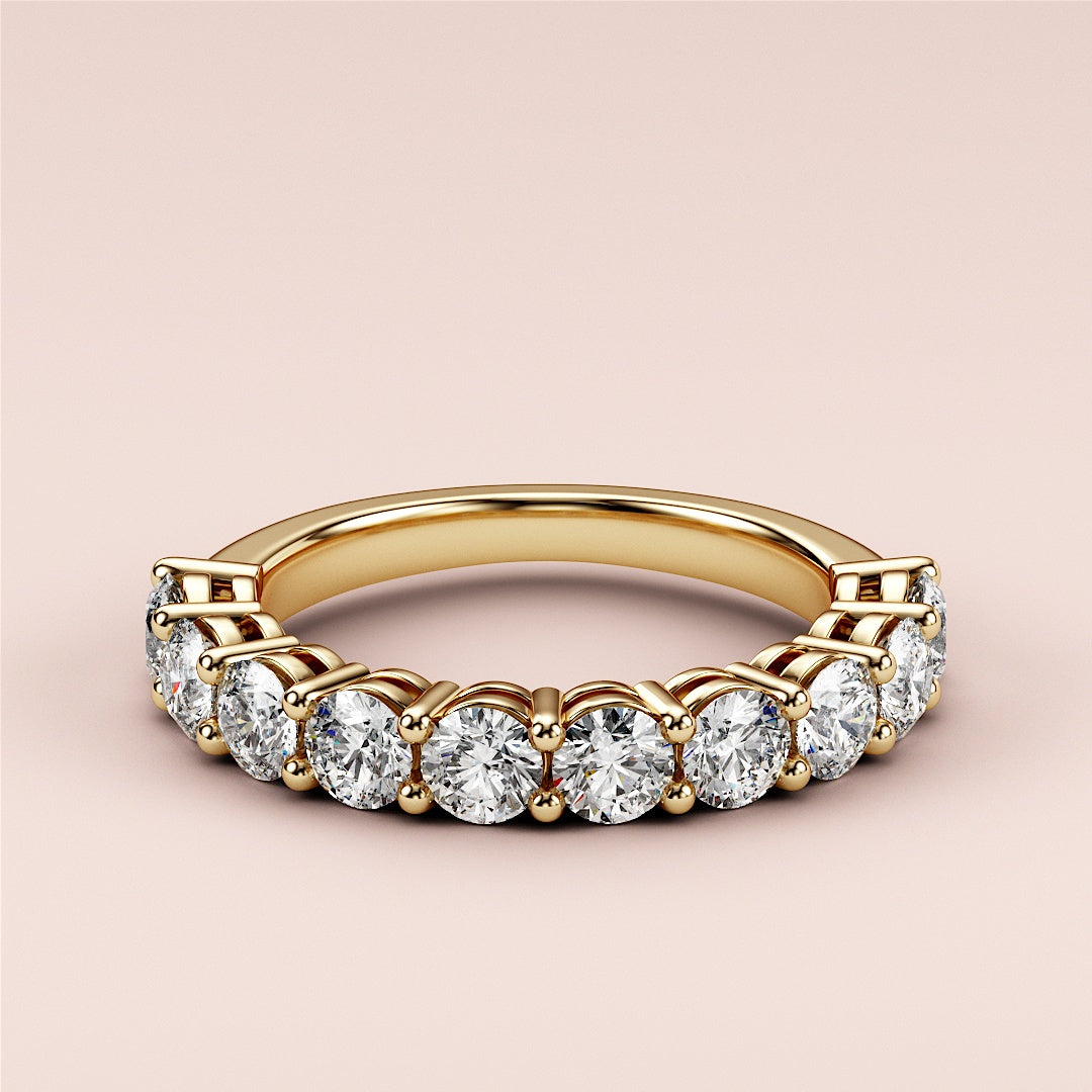 Elegant 14K or 18K yellow gold wedding band featuring round brilliant-cut diamonds in a prong setting, perfect for eternity. |
 
 
 #14KRecycledYellowGold
 #18KRecycledYellowGold