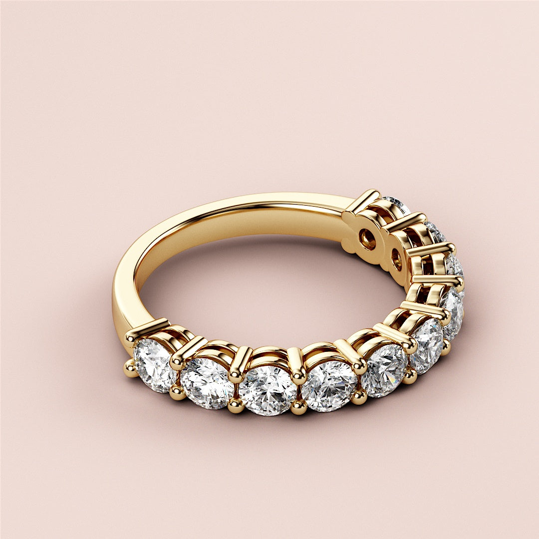 Elegant yellow gold wedding band featuring round-cut diamonds in a prong setting, available in 14K or 18K options. |
 
 
 #14KRecycledYellowGold
 #18KRecycledYellowGold
