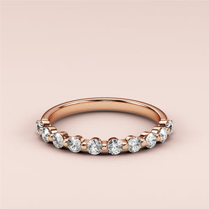 Elegant 14K or 18K rose gold eternity band featuring round brilliant diamonds, showcasing timeless beauty and luxury. 