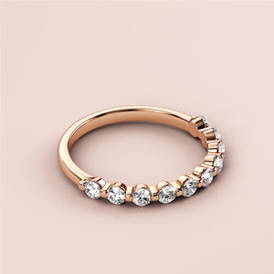 Elegant rose gold half eternity wedding band featuring round brilliant diamonds, available in 14K, 18K, or platinum. 