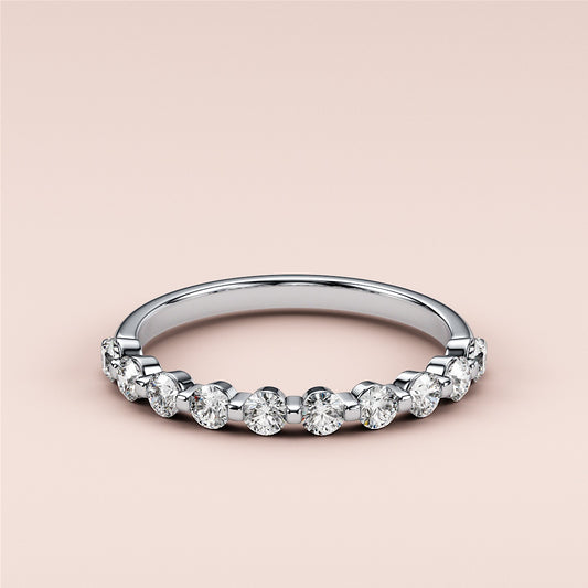 Elegant round diamond eternity band in 14K white gold, featuring alternating brilliant diamonds.  Ideal for weddings and anniversaries. 