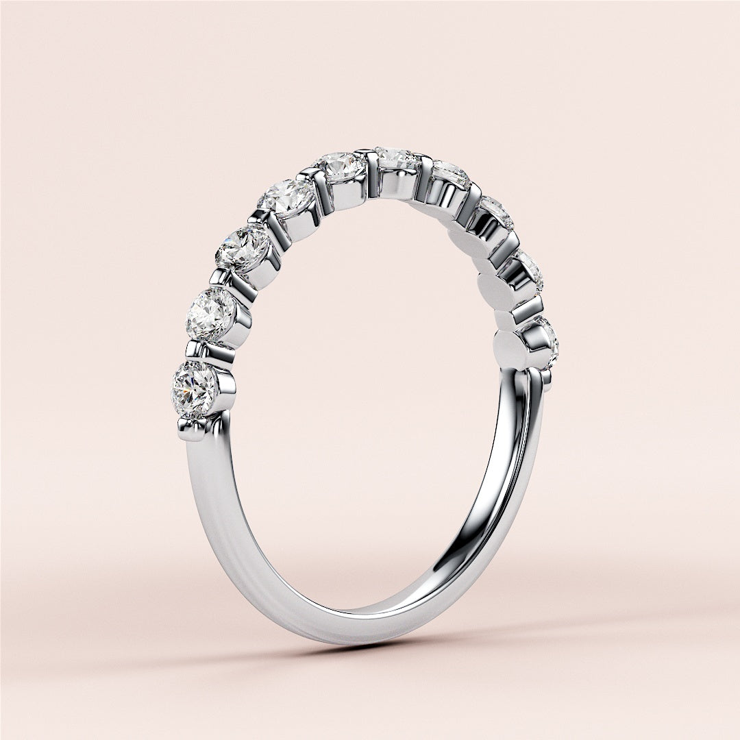 Elegant white gold or platinum half eternity wedding band with round diamonds, available in 14K and 18K for bridal elegance. 