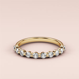 Elegant 14K Yellow Gold half eternity wedding band with round cut diamonds for timeless style and beauty. 