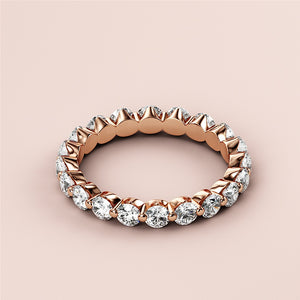 Elegant 14K/18K rose gold eternity wedding band with marquise-cut diamonds, showcasing a luxurious and timeless design. 