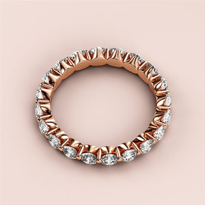 Elegant 14K rose gold eternity wedding band featuring round brilliant-cut diamonds in a timeless design. 
