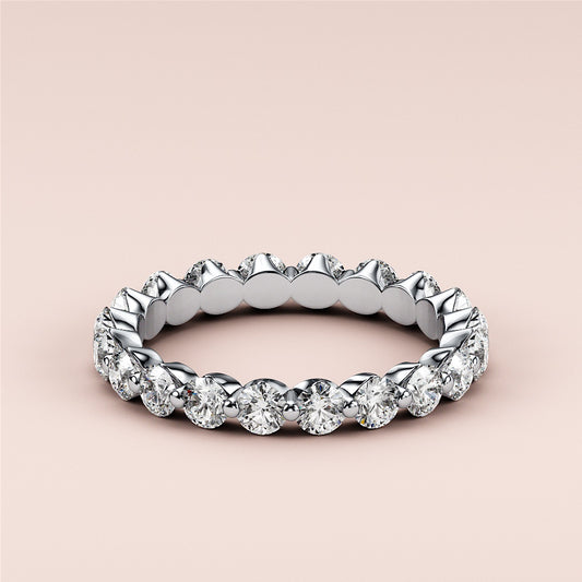 Stunning 14K white gold diamond eternity wedding band with round brilliant-cut diamonds in prong setting, perfect for lasting elegance. 