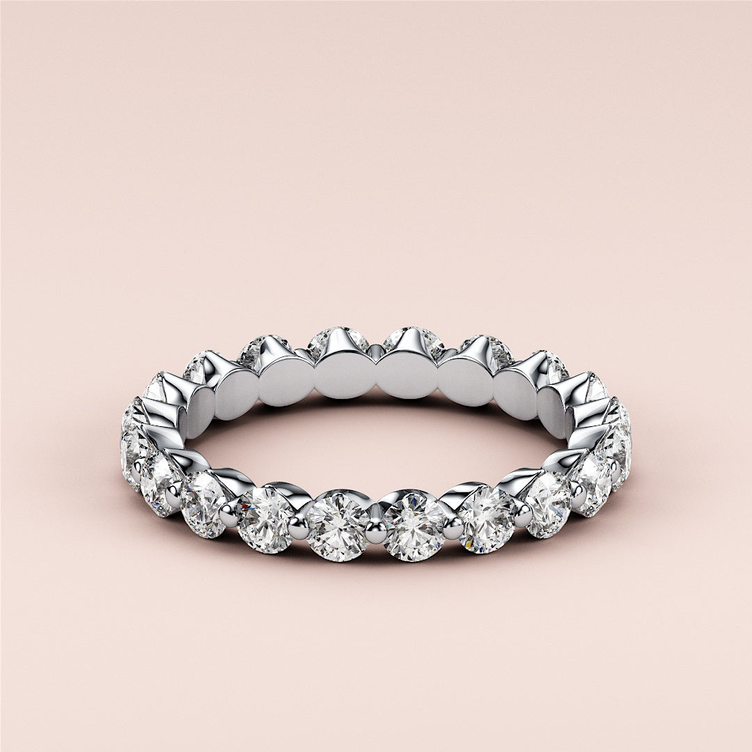 Stunning 14K white gold diamond eternity wedding band with round brilliant-cut diamonds in prong setting, perfect for lasting elegance. 