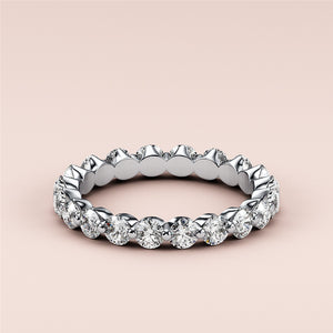 Stunning 14K white gold diamond eternity wedding band with round brilliant-cut diamonds in prong setting, perfect for lasting elegance. 