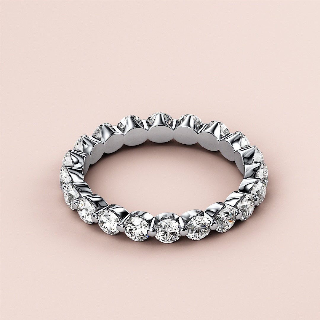 Elegant 14K or 18K gold diamond eternity ring with round brilliant-cut diamonds, ideal for wedding bands or anniversary gifts. 