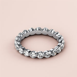 Elegant 14K or 18K gold diamond eternity ring with round brilliant-cut diamonds, ideal for wedding bands or anniversary gifts. 