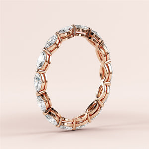 Elegant marquise eternity wedding band with diamonds in 14K/18K rose gold, showcasing a timeless design. 