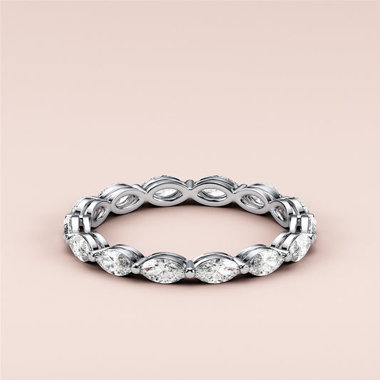 Elegant marquise eternity wedding band in 14K or 18K white gold, featuring stunning diamond accents for timeless luxury. 