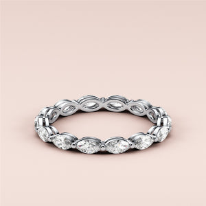 Elegant marquise eternity wedding band in 14K or 18K white gold, featuring stunning diamond accents for timeless luxury. 