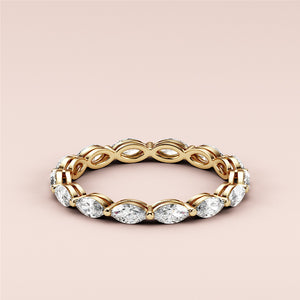 Elegant marquise-cut diamond eternity wedding band in 14K or 18K gold, showcasing luxury and timeless design with sparkling diamonds. 