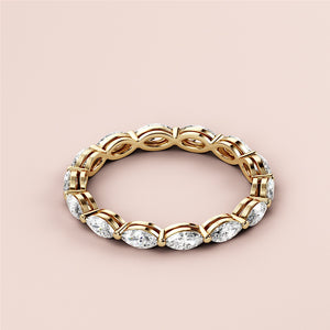 Elegant marquise-cut diamond eternity band in 14K or 18K gold, showcasing alternating marquise-shaped diamonds for a luxurious wedding band. 