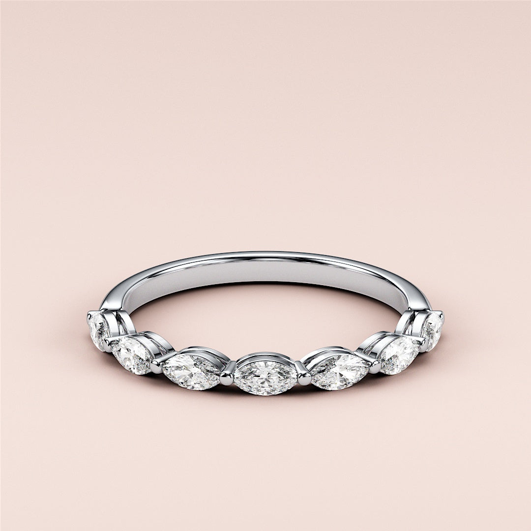 Elegant 14K/18K/Platinum marquise half eternity wedding band with diamond accents, showcasing intricate design details. 