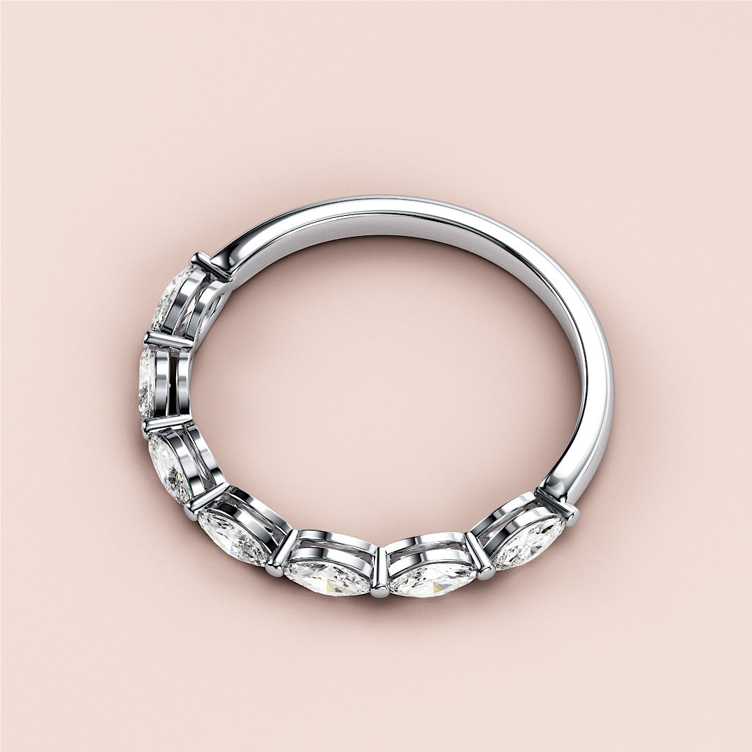 Elegant wedding band featuring marquise-cut diamonds in a shared prong setting, available in 14K or 18K gold and platinum. |
 #14KRecycledWhiteGold
 #18KRecycledWhiteGold
 
 
 
 
 #Platinum
