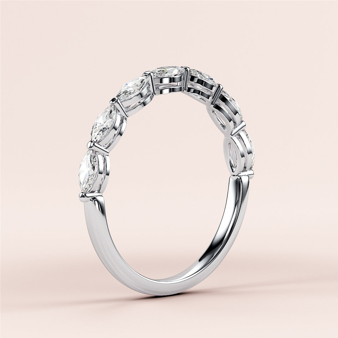 Elegant marquise half eternity wedding band featuring diamonds in a 14K or 18K white gold band, perfect for timeless elegance. |
 #14KRecycledWhiteGold
 #18KRecycledWhiteGold
 
 
 
 
 #Platinum