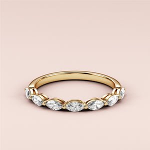 14K/18K yellow gold half eternity wedding band featuring marquise-cut diamonds, close-up view for elegance and shine. 