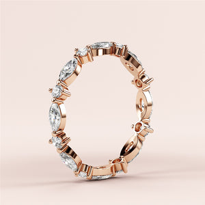 Elegant marquise diamond eternity band in 14K rose gold, featuring alternating marquise and round diamonds. 