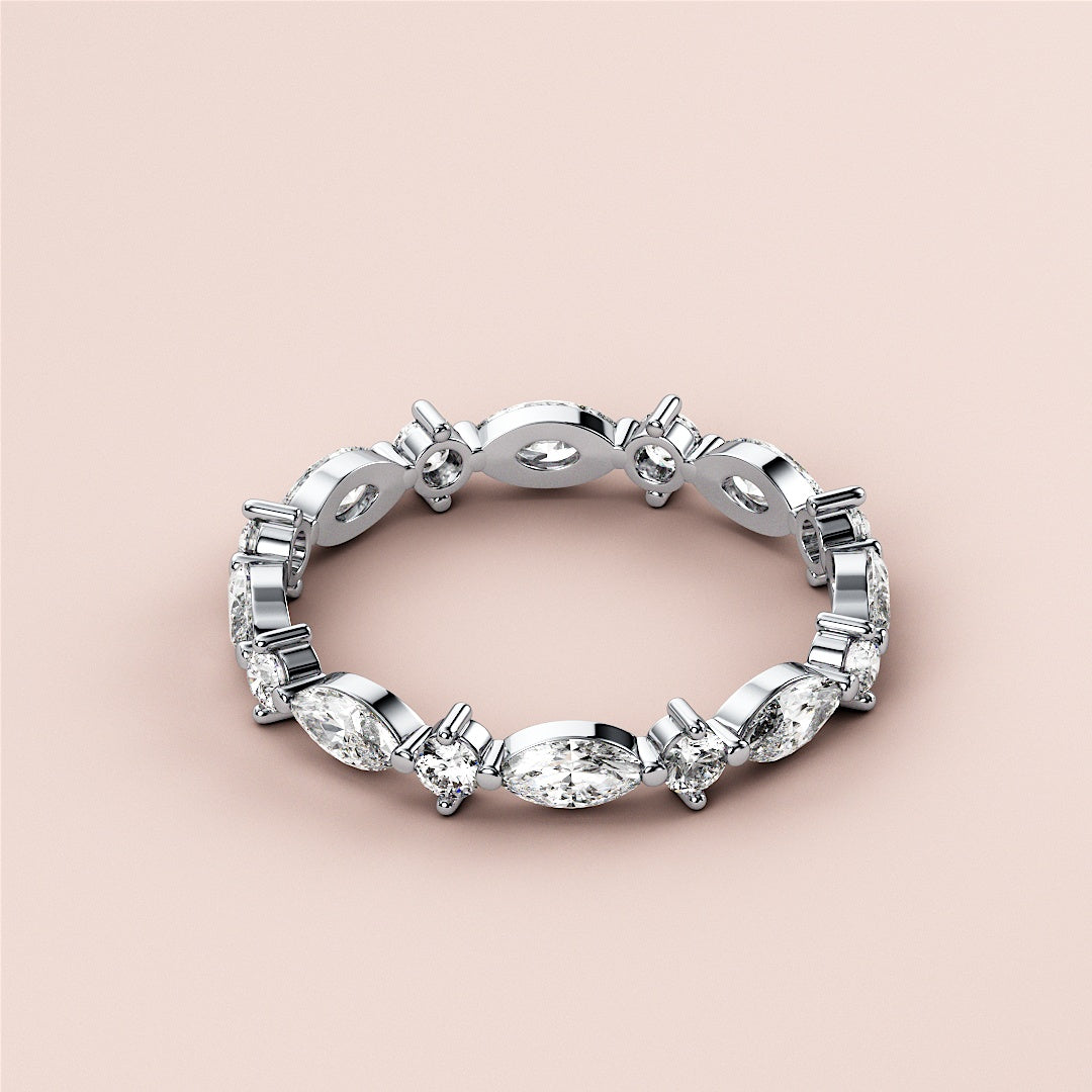 Elegant 14K or 18K white gold wedding band featuring marquise and baguette-cut diamonds, perfect for eternity celebrations. |
 #14KRecycledWhiteGold
 #18KRecycledWhiteGold
 
 
 
 
 #Platinum