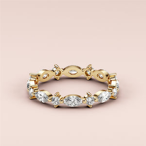 Elegant 14K or 18K yellow gold marquise and round-cut diamond eternity ring, perfect as a wedding band. 