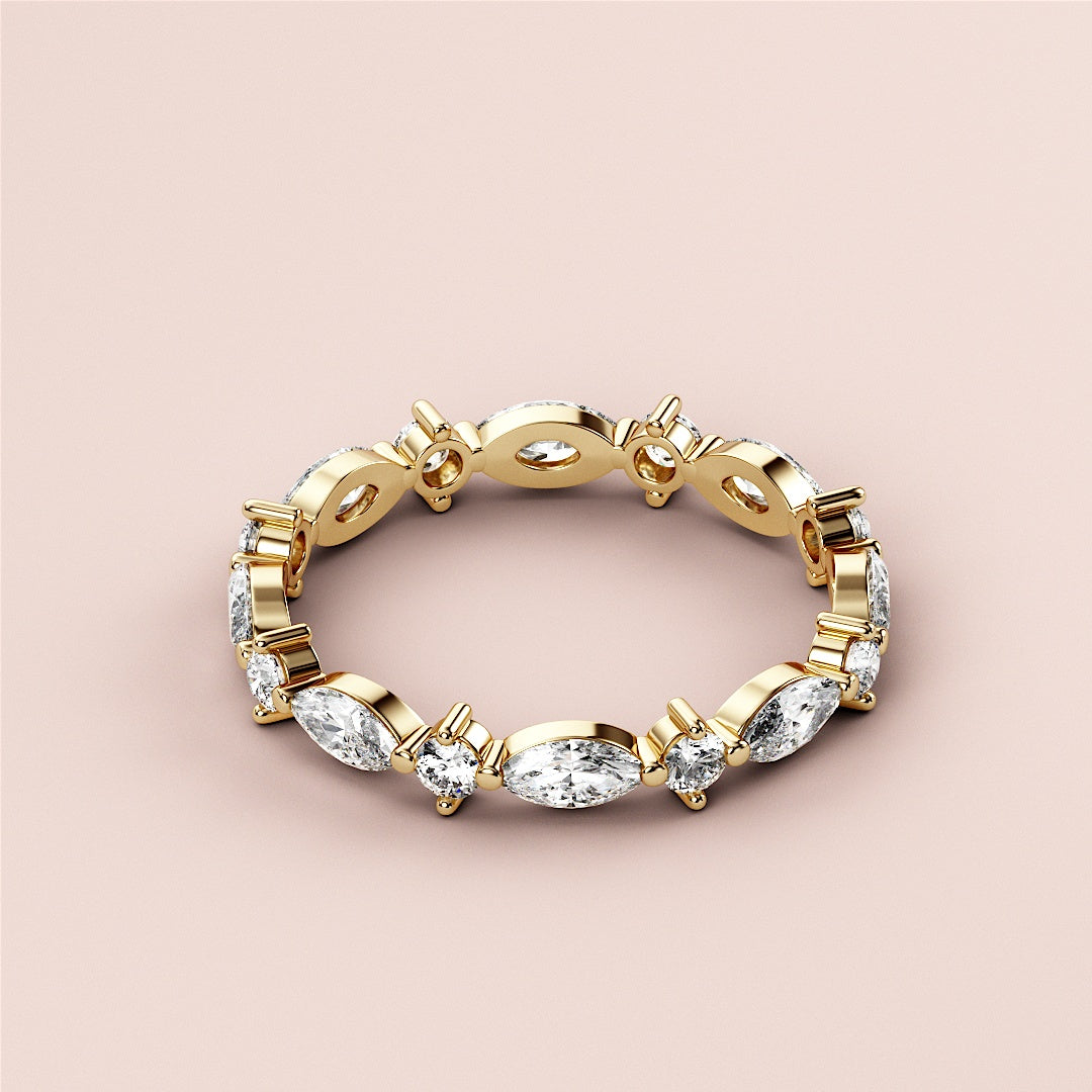 Elegant 14K or 18K yellow gold marquise and round eternity wedding band with dazzling diamonds, displayed on a neutral background. |
 
 
 #14KRecycledYellowGold
 #18KRecycledYellowGold