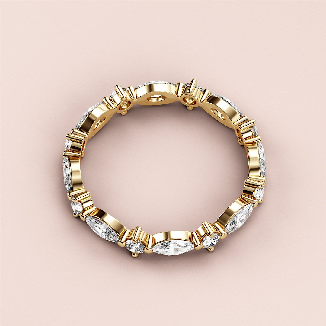 14K yellow gold eternity wedding band featuring marquise-cut diamond accents; close-up product shot. |
 
 
 #14KRecycledYellowGold
 #18KRecycledYellowGold