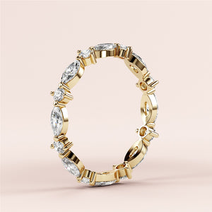 Elegant marquise and round diamond eternity band in 14K yellow gold, perfect for weddings.  Sophisticated design without model. 