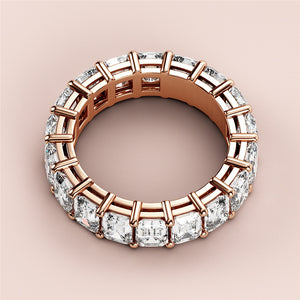Elegant oval diamond solitaire engagement ring in 14K or 18K rose gold, featuring a hidden halo and plain band.