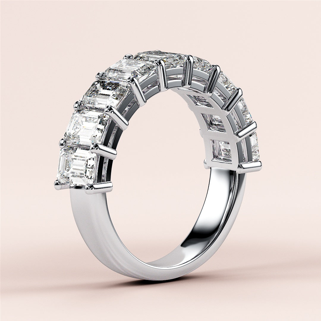 Elegant emerald-cut diamond wedding band in 14K or 18K white gold setting, featuring a row of sparkling emerald diamonds. |
 #14KRecycledWhiteGold
 #18KRecycledWhiteGold
 
 
 
 
 #Platinum