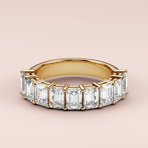 Elegant 14K yellow gold half eternity wedding band featuring radiant cut diamonds, also available in 18K and platinum. 