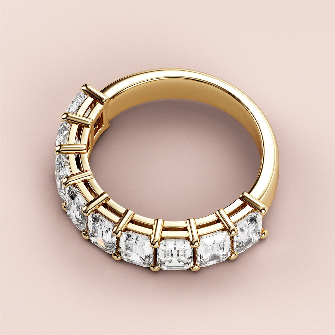 Elegant yellow gold half eternity wedding band featuring emerald-cut diamonds, crafted from 14K or 18K gold or platinum. |
 
 
 #14KRecycledYellowGold
 #18KRecycledYellowGold