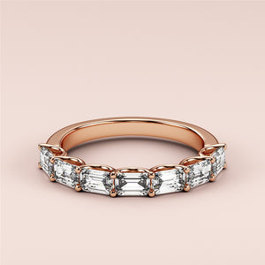 Elegant rose gold wedding band featuring baguette-cut diamonds, available in 14K, 18K gold, or platinum eternity style. 