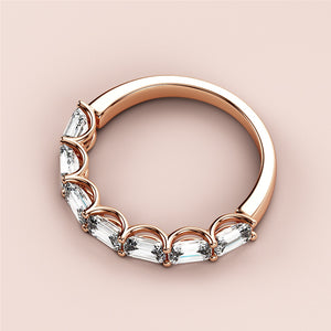 Elegant rose gold half eternity wedding band featuring emerald-cut diamonds, available in 14K, 18K, or platinum. 
