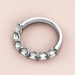 Elegant 14K/18K white gold eternity wedding band featuring emerald-cut diamonds against a soft beige background. 