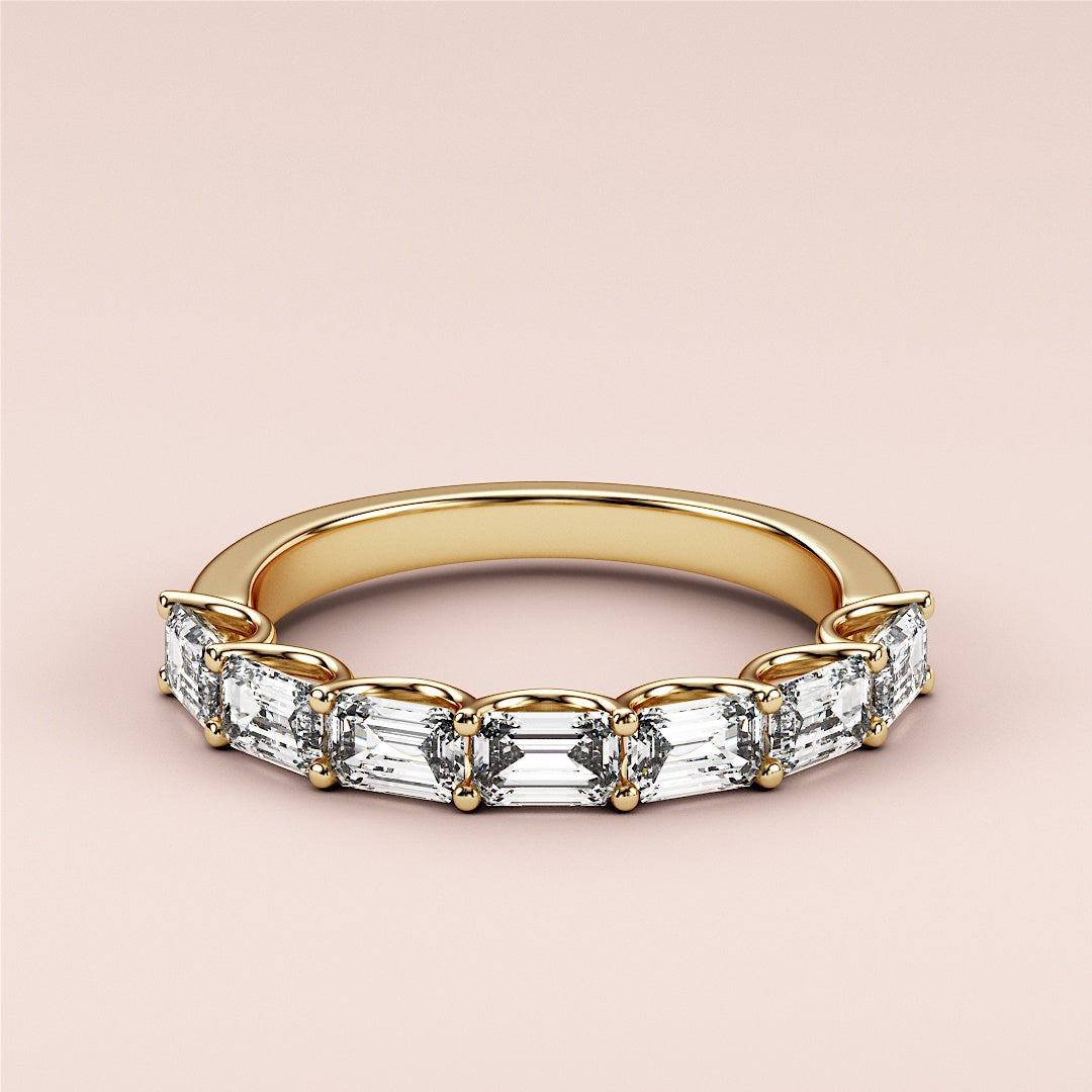 Elegant yellow gold wedding band featuring a unique half-circle design with emerald-cut diamond stones, crafted in 14K or 18K gold. |
 
 
 #14KRecycledYellowGold
 #18KRecycledYellowGold