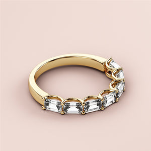 Elegant 14K or 18K yellow gold emerald half eternity wedding band, featuring stunning marquise-cut diamonds for timeless sophistication. 