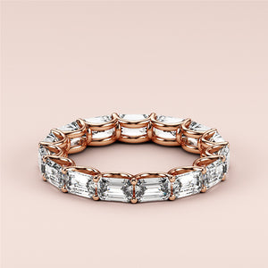 Elegant 14K rose gold eternity wedding band featuring emerald-cut diamonds, showcasing exquisite design and craftsmanship. 