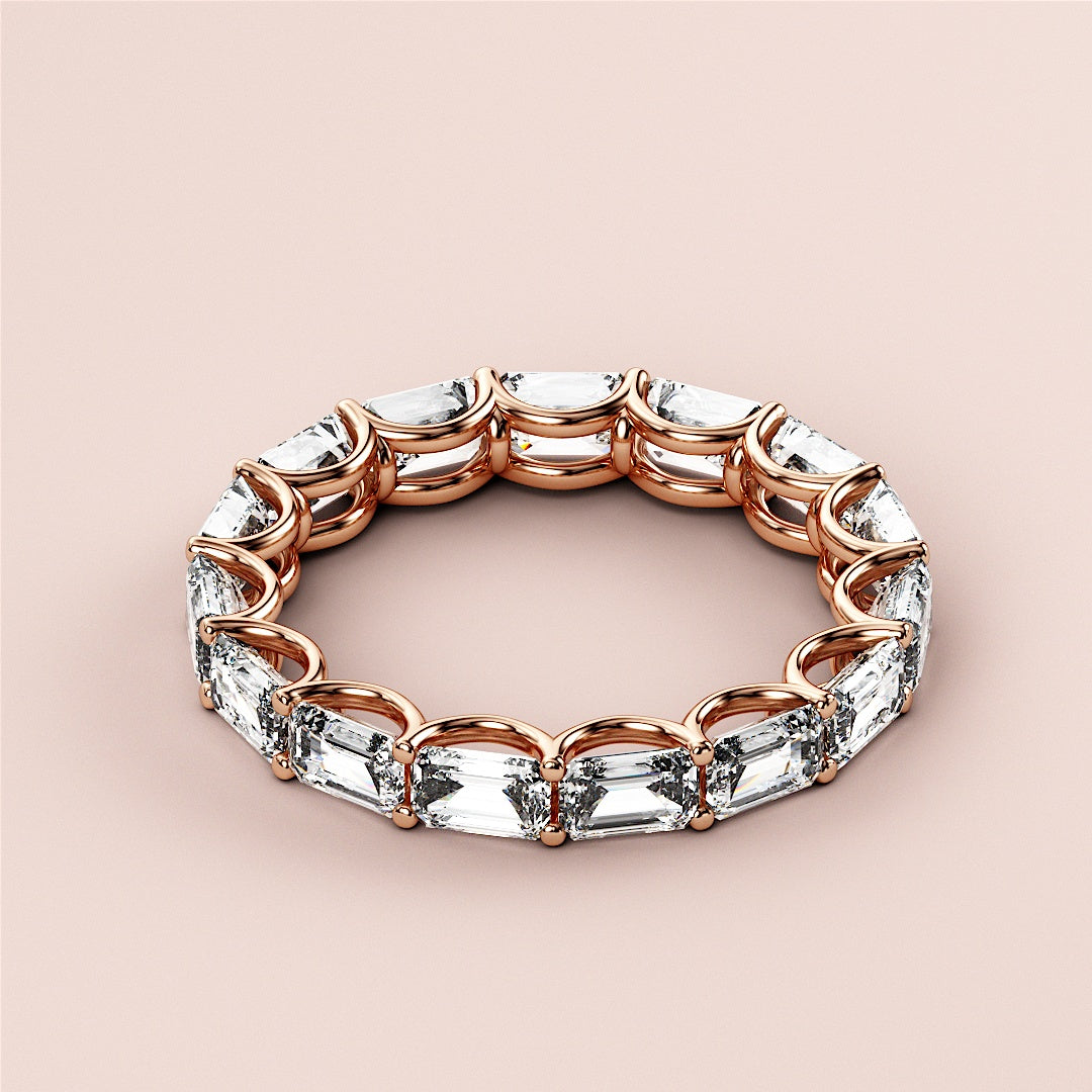 Elegant 14K rose gold emerald eternity wedding band featuring pear-shaped diamonds.  Perfect for timeless celebrations. |
 
 
 
 
 #14KRecycledRoseGold
 #18KRecycledRoseGold