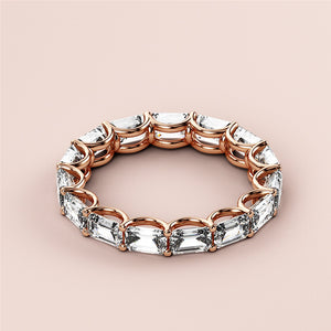Elegant 14K rose gold emerald eternity wedding band featuring pear-shaped diamonds.  Perfect for timeless celebrations. 