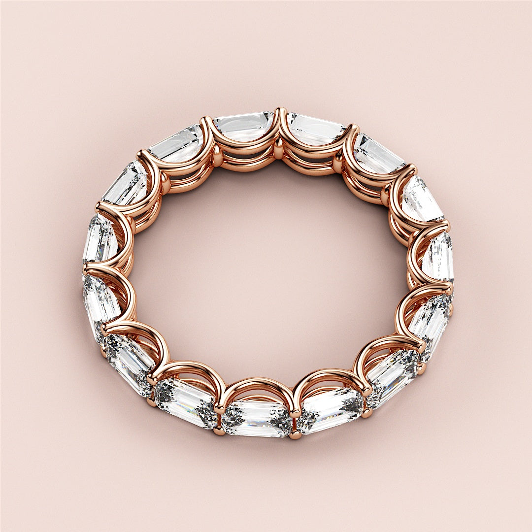 Elegant rose gold wedding band, a 14K or 18K eternity ring featuring sparkling oval-cut diamonds in a continuous loop design. |
 
 
 
 
 #14KRecycledRoseGold
 #18KRecycledRoseGold