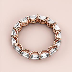 Elegant rose gold wedding band, a 14K or 18K eternity ring featuring sparkling oval-cut diamonds in a continuous loop design. 