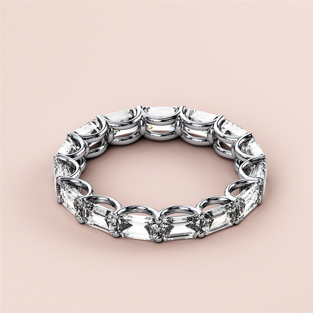 Luxurious 14K white gold emerald eternity wedding band featuring pear-shaped diamonds, not worn on a model. |
 #14KRecycledWhiteGold
 #18KRecycledWhiteGold
 
 
 
 
 #Platinum