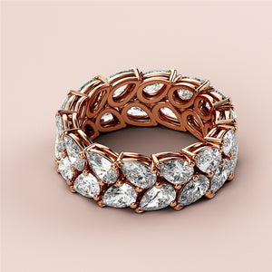 Elegant 14K or 18K rose gold wedding eternity band featuring pear-shaped diamonds in a sparkling two-row design. 