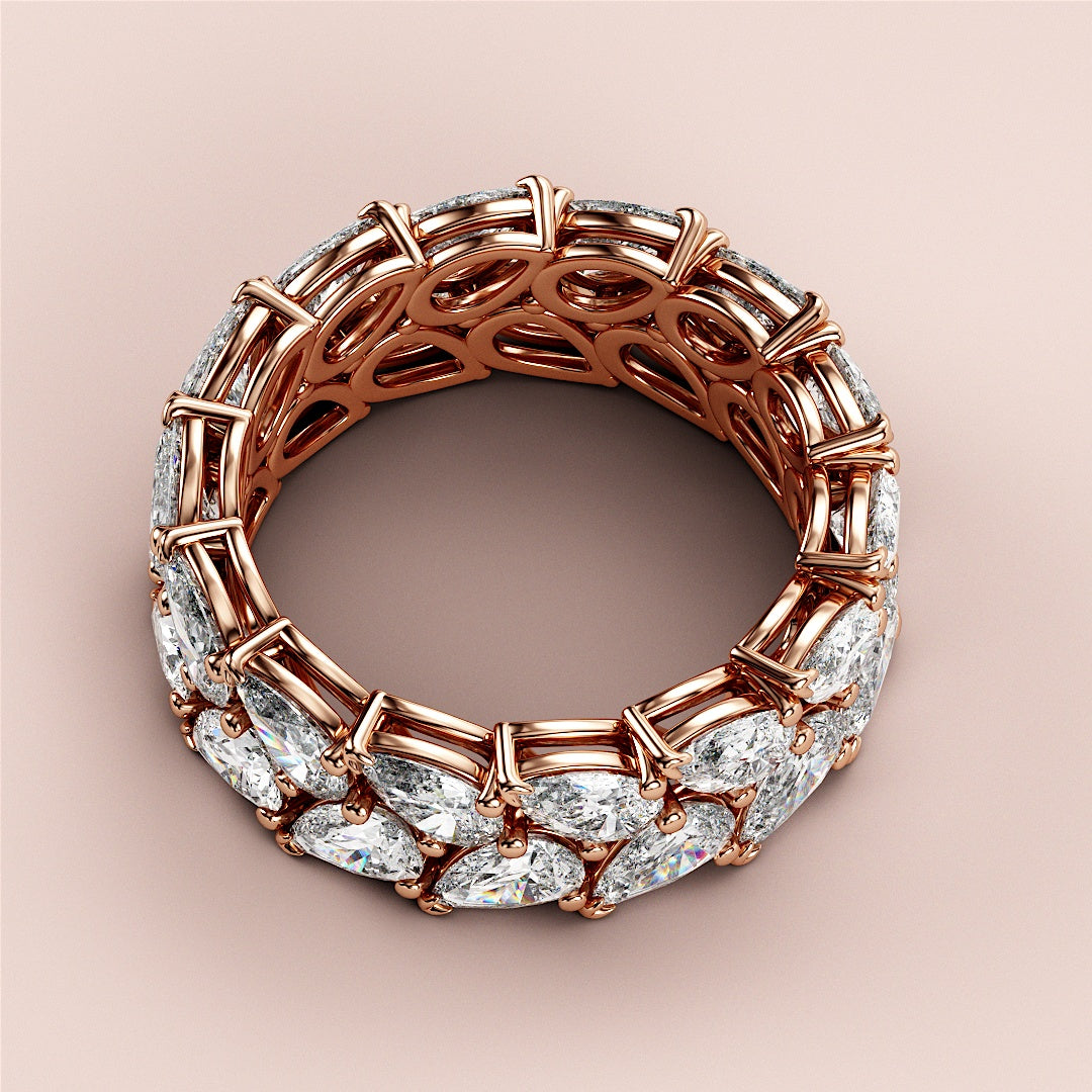 Elegant 14K rose gold wedding band featuring teardrop-shaped diamonds in a chic two-row eternity design. |
 
 
 
 
 #14KRecycledRoseGold
 #18KRecycledRoseGold
