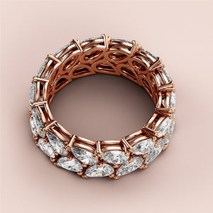 Elegant 14K rose gold wedding band featuring teardrop-shaped diamonds in a chic two-row eternity design. 