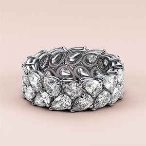 Elegant 14K or 18K gold or platinum eternity wedding band set with brilliant oval-shaped diamonds on a neutral background. 