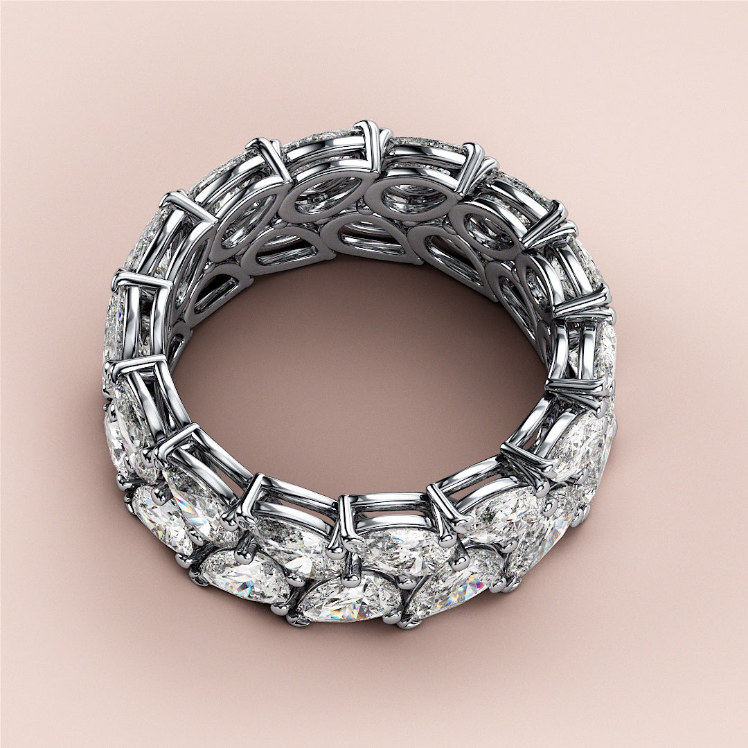 Luxury pear-shaped diamond eternity band in 14K/18K gold or platinum, elegantly displayed against a neutral background. |
 #14KRecycledWhiteGold
 #18KRecycledWhiteGold
 
 
 
 
 #Platinum